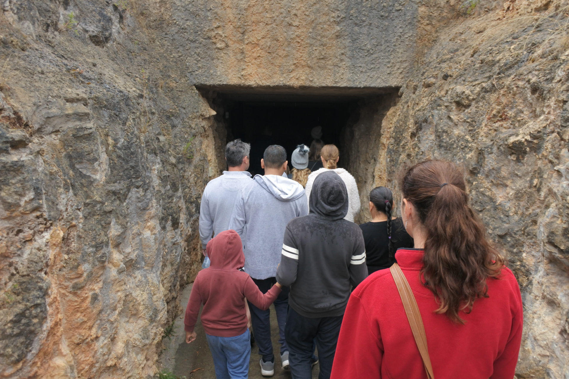 A group enters Naracoote Caves for a school excursion 