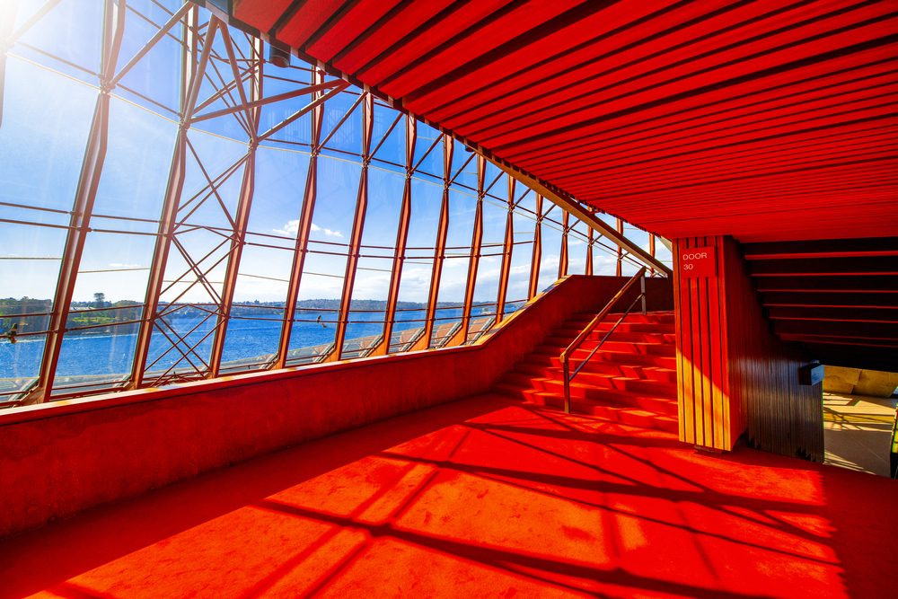 the red interiors of sydney opera house & striking architecture 