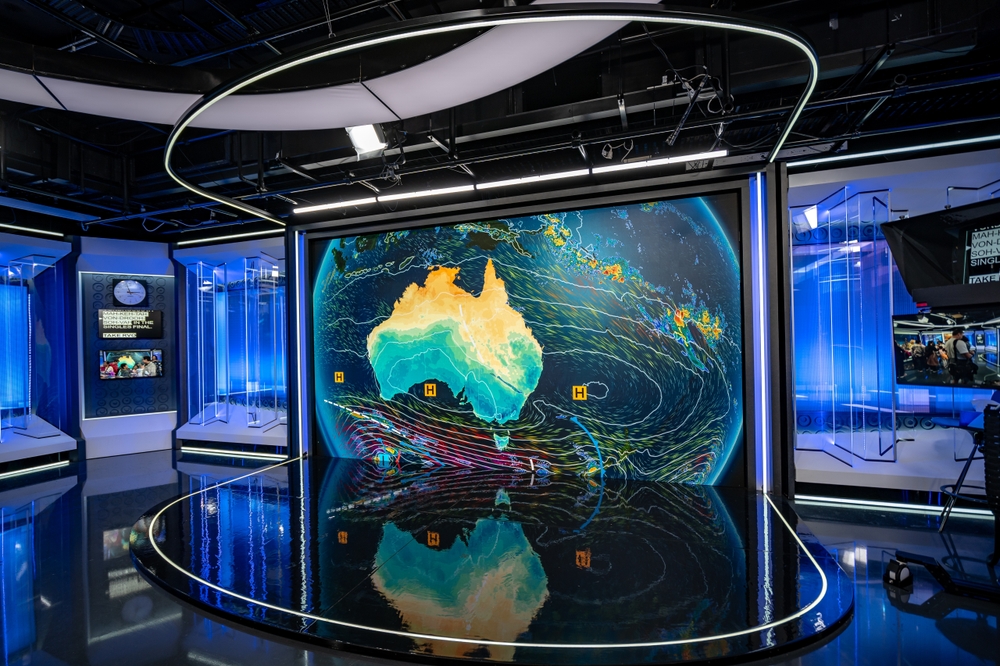 A shot of the ABC Newsroom studio with a map of Australia on the big screen