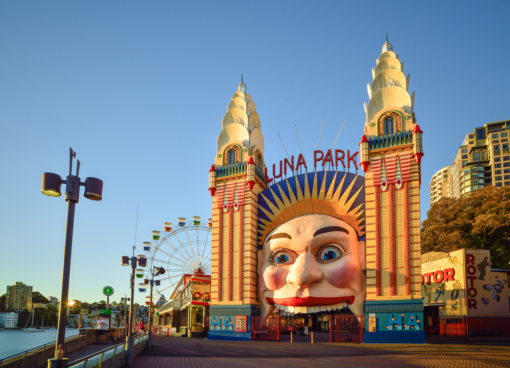a sunset shot of the iconic luna park clown face entry 
